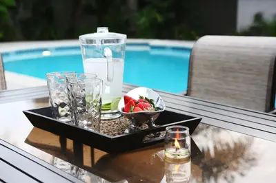 a tray with a drink and a bowl of fruit on a table at Destination #06 in Anaheim