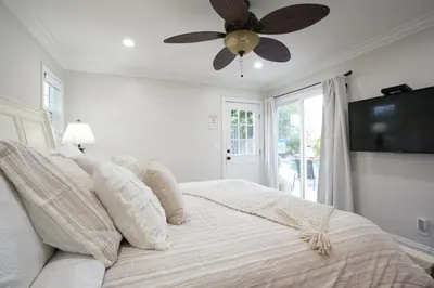 a bedroom with a bed with a ceiling fan at Destination #02 in Anaheim