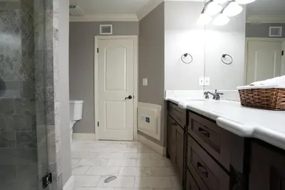 a bathroom with a sink and a toilet and a mirror at Destination #03 in Fullerton