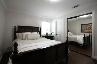 a bedroom with a large bed and a mirror at Destination #07 in Anaheim