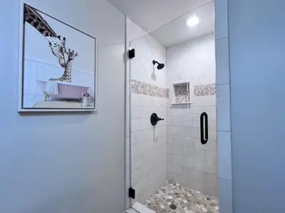 a bathroom with a shower with a sink at Destination #07 in Anaheim
