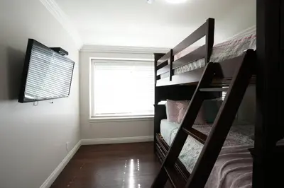 a bedroom with two bunk beds and a window at Destination #07 in Anaheim