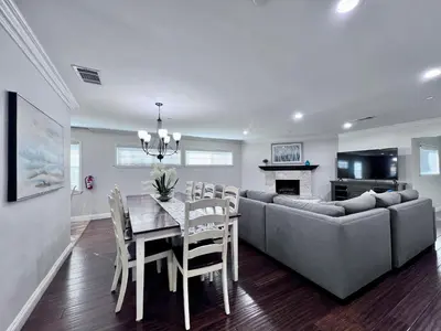a dining room and living room with a couch and a table at Destination #07 in Anaheim