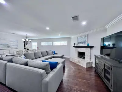 a living room with a couch and a fireplace at Destination #07 in Anaheim