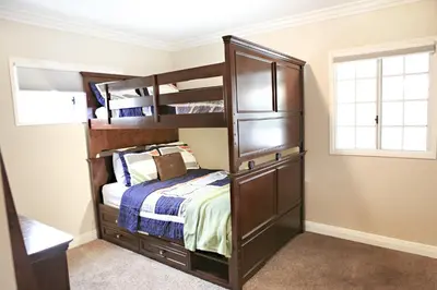 a bedroom with bunk beds and a bed at Destination #10 in Anaheim