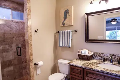 a bathroom with a toilet and a sink and a shower at Destination #10 in Anaheim