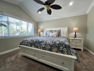 a bedroom with a bed and a ceiling fan at Destination #23 in Anaheim