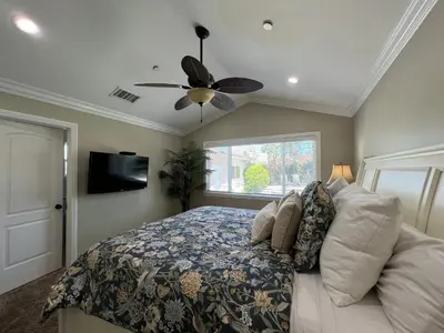 a bedroom with a bed and a ceiling fan at Destination #23 in Anaheim