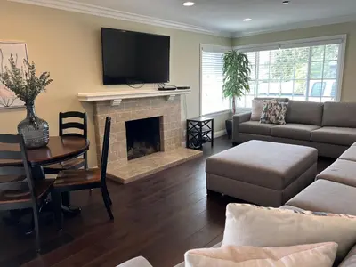 a living room with a couch and a fireplace at Destination #23 in Anaheim