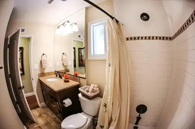 a bathroom with a toilet and a sink and a shower at Destination #08 in Anaheim