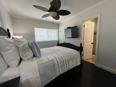 a bedroom with a bed and a ceiling fan at Destination #12 in Anaheim