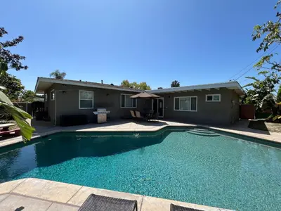 a swimming pool in front of a house at Destination #12 in Anaheim