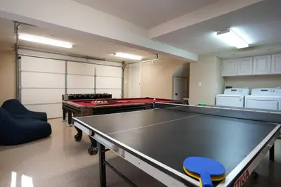 a ping pong room with a ping pong table at Nostalgic PoolJacuzzi Home: GameRm1.8 Mi 2Disney in Anaheim