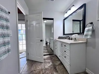 a bathroom with a sink and a mirror at Destination #13 in Anaheim
