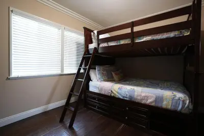 a bedroom with two bunk beds and a window at Destination #19 in Anaheim