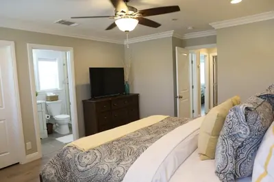a bedroom with a bed and a flat screen tv at Destination #37 in Fullerton
