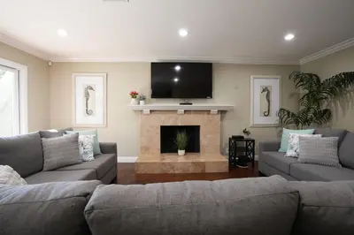 a living room with two couches and a fireplace at Destination #05 in Anaheim