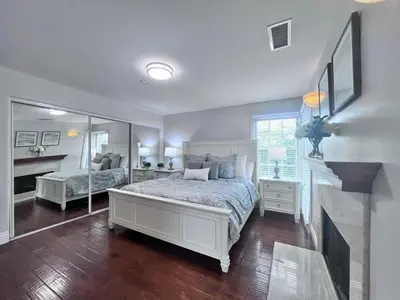 a bedroom with a bed and a mirror at Destination #09 in Anaheim