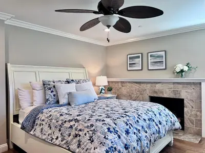 a bedroom with a bed and a ceiling fan at Destination #21 in Anaheim