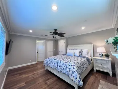 a bedroom with a bed and a ceiling fan at Destination #21 in Anaheim