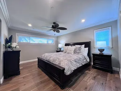 a bedroom with a bed and a ceiling fan at Destination #21 in Anaheim