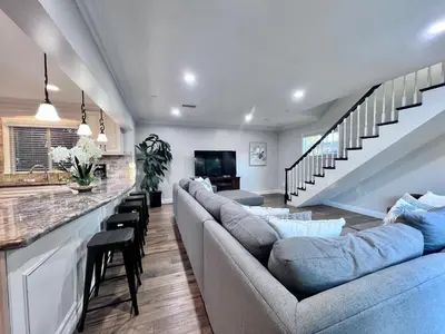 a living room with a couch and a bar at Destination #28 in Anaheim