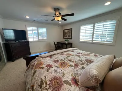 a bedroom with a bed and a ceiling fan at Destination #16 in Anaheim