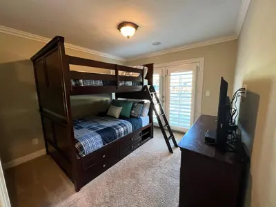 a bedroom with a bunk bed with a ladder at Destination #16 in Anaheim
