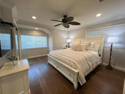 a bedroom with a bed and a ceiling fan at Destination #29 in Anaheim