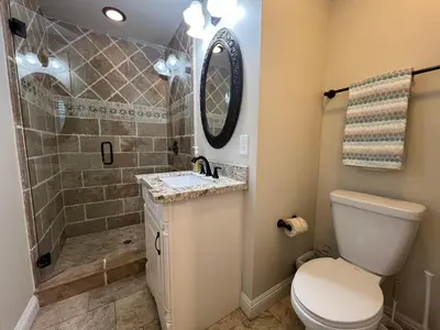 a bathroom with a shower and a toilet and a sink at Destination #29 in Anaheim