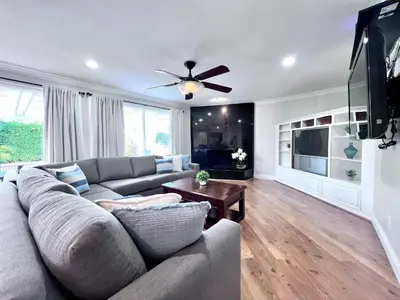 a living room with a couch and a flat screen tv at Destination #36 in Anaheim