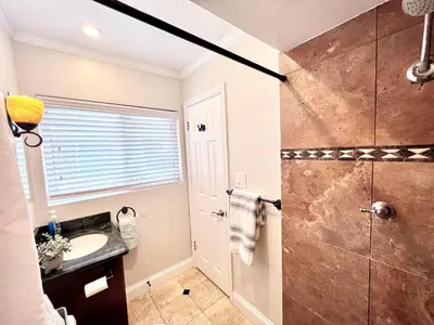 a bathroom with a shower and a sink at Destination #36 in Anaheim