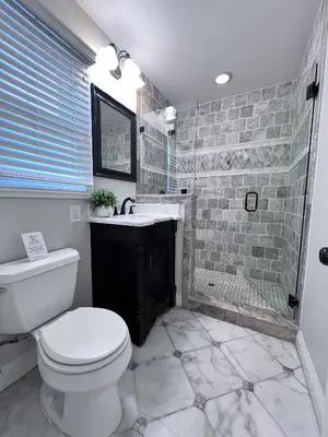 a bathroom with a toilet and a sink and a shower at Destination #30 in Anaheim
