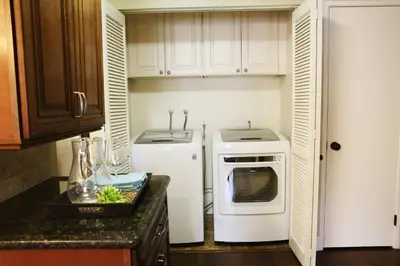 a small kitchen with a white oven and a sink at Destination #20 in Anaheim