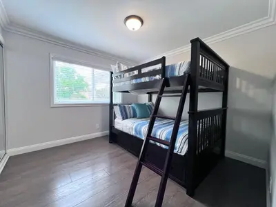 a bedroom with two bunk beds and a window at Destination #33 in Orange