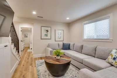 a living room with a couch and a table at Destination #43 in Orange
