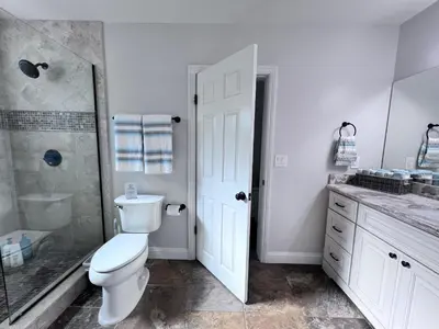 a bathroom with a toilet and a shower and a sink at Destination #22 in Anaheim