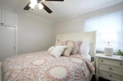 a bedroom with a bed and a ceiling fan at Destination #22 in Anaheim