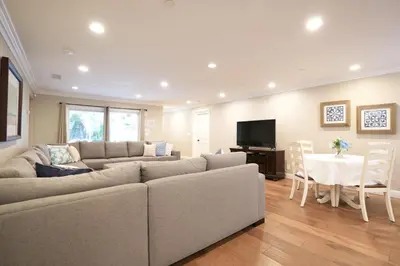 a living room with a couch and a dining room at Destination #31 in Anaheim