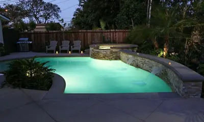 a swimming pool in a backyard with a landscaping at Destination #31 in Anaheim