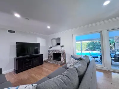 a living room with a couch and a television at Destination #25 in Anaheim