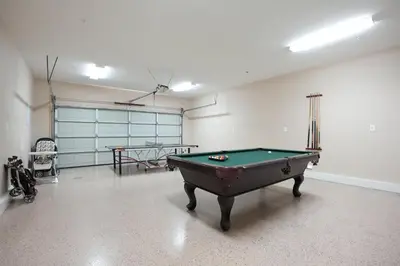 a garage with a pool table in a room at Destination #25 in Anaheim
