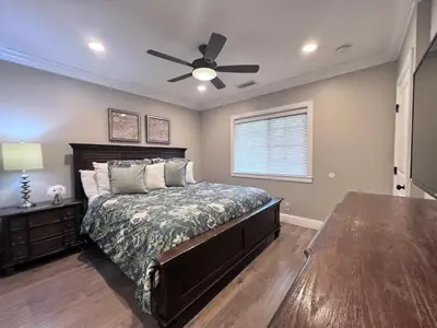 a bedroom with a bed and a ceiling fan at Destination #34 in Santa Ana