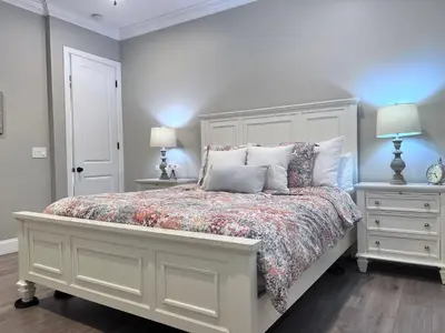 a bedroom with a bed with two night stands and two lamps at Destination #34 in Santa Ana
