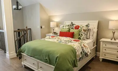 a bedroom with a bed with a green comforter at Destination #34 in Santa Ana