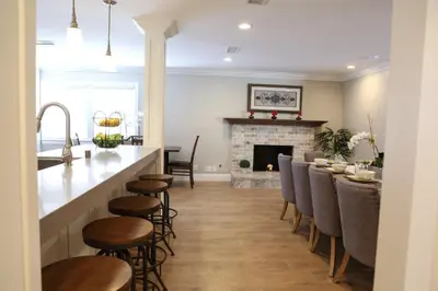 a kitchen and living room with a bar and a fireplace at Destination #35 in Anaheim