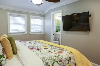 a bedroom with a bed and a flat screen tv at Destination #35 in Anaheim