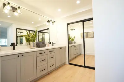 a bathroom with two sinks and a shower at Destination #50 in Placentia