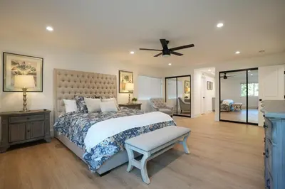 a bedroom with a bed and a ceiling fan at Destination #50 in Placentia
