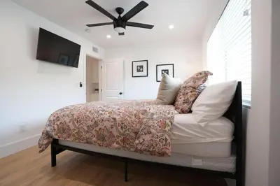 a bedroom with a bed and a ceiling fan at Destination #50 in Placentia